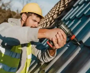 side-view-man-working-roof-with-drill-1_2_11zon